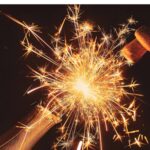 Fireworks coming out of a champagne bottle