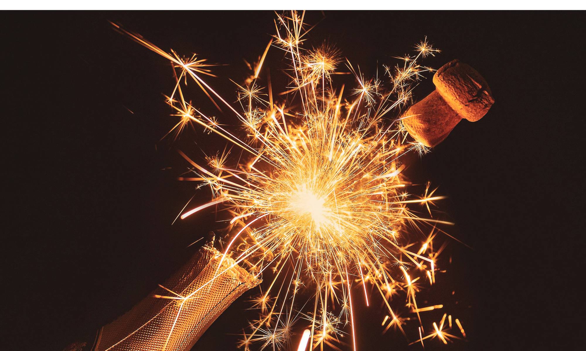Fireworks coming out of a champagne bottle