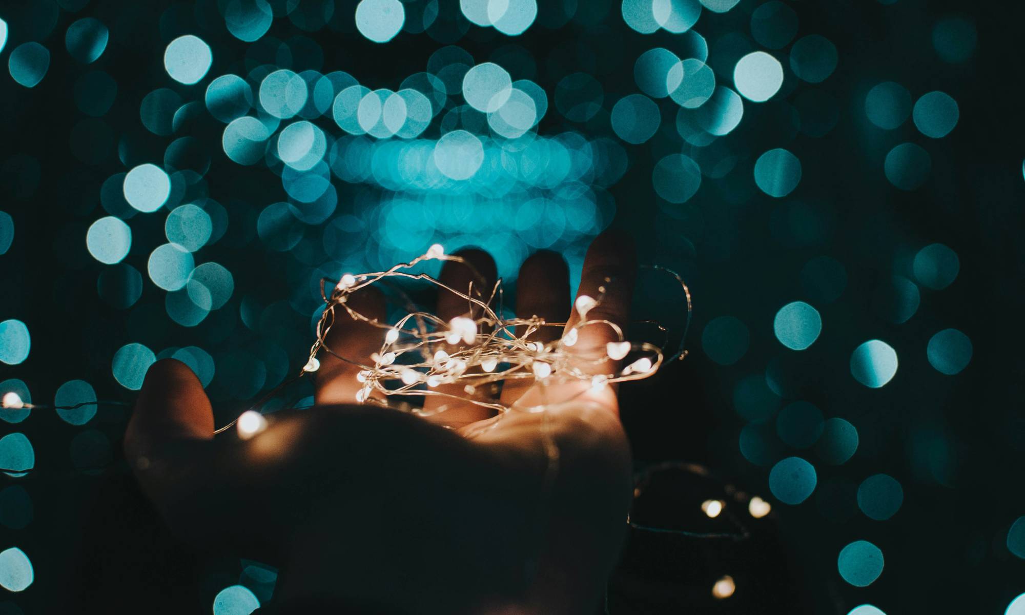 person holding lights in their hand